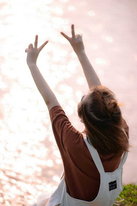 a woman raising her hand